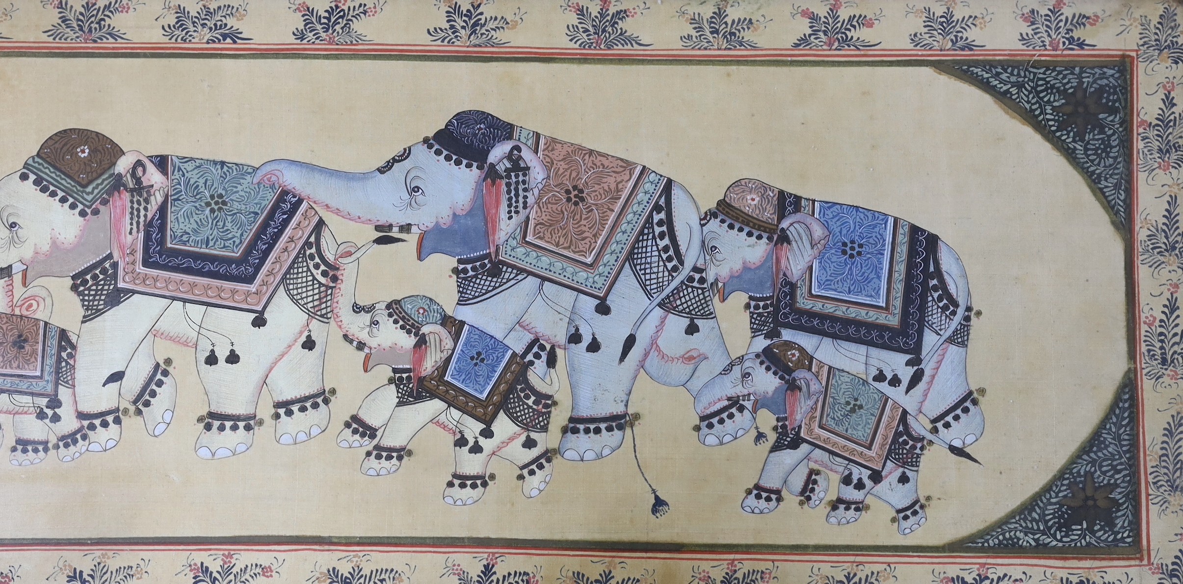 An Indian watercolour on silk, elephants, framed.